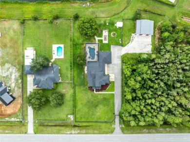 Welcome to your private retreat in the heart of Wedgefield, FL! on Wedgefield Golf Club in Florida - for sale on GolfHomes.com, golf home, golf lot
