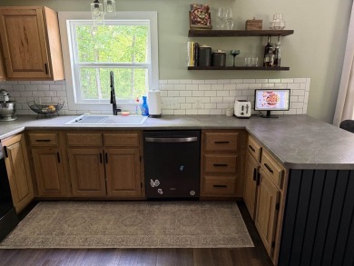 Nestled in the heart of Lakewood, this beautifully updated home on McCauslin Brook Golf and Country Club in Wisconsin - for sale on GolfHomes.com, golf home, golf lot