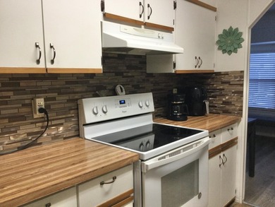 Meticulously maintained home in the much sought after Spanish on Spanish Lakes I in Florida - for sale on GolfHomes.com, golf home, golf lot