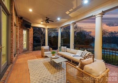 Stunning lakefront home in the exclusive gated community of on Carmel Country Club in North Carolina - for sale on GolfHomes.com, golf home, golf lot