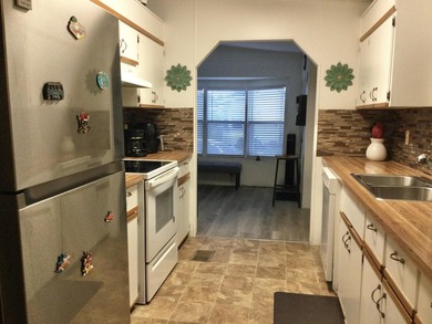 Meticulously maintained home in the much sought after Spanish on Spanish Lakes I in Florida - for sale on GolfHomes.com, golf home, golf lot