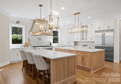 Stunning lakefront home in the exclusive gated community of on Carmel Country Club in North Carolina - for sale on GolfHomes.com, golf home, golf lot