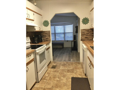 Meticulously maintained home in the much sought after Spanish on Spanish Lakes I in Florida - for sale on GolfHomes.com, golf home, golf lot