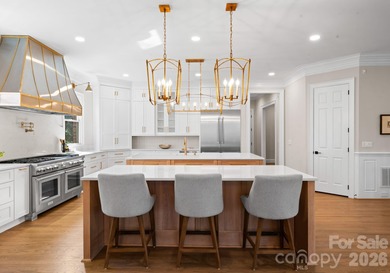 Stunning lakefront home in the exclusive gated community of on Carmel Country Club in North Carolina - for sale on GolfHomes.com, golf home, golf lot