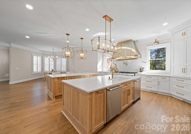 Stunning lakefront home in the exclusive gated community of on Carmel Country Club in North Carolina - for sale on GolfHomes.com, golf home, golf lot