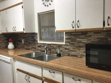 Meticulously maintained home in the much sought after Spanish on Spanish Lakes I in Florida - for sale on GolfHomes.com, golf home, golf lot