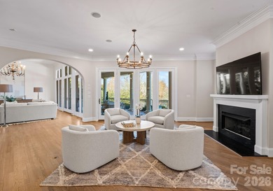 Stunning lakefront home in the exclusive gated community of on Carmel Country Club in North Carolina - for sale on GolfHomes.com, golf home, golf lot