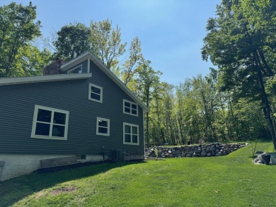 Nestled in the heart of Lakewood, this beautifully updated home on McCauslin Brook Golf and Country Club in Wisconsin - for sale on GolfHomes.com, golf home, golf lot