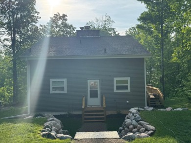 Nestled in the heart of Lakewood, this beautifully updated home on McCauslin Brook Golf and Country Club in Wisconsin - for sale on GolfHomes.com, golf home, golf lot
