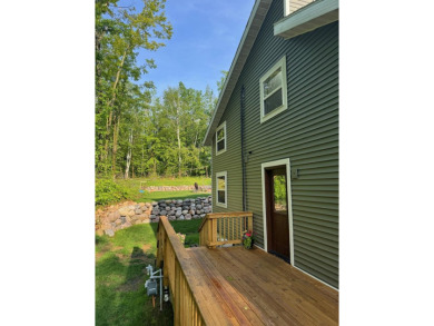 Nestled in the heart of Lakewood, this beautifully updated home on McCauslin Brook Golf and Country Club in Wisconsin - for sale on GolfHomes.com, golf home, golf lot