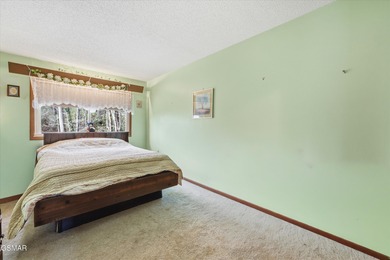 This 3-bedroom, 2-bath beauty sits on two very private lots on Bent Creek Golf Course in Tennessee - for sale on GolfHomes.com, golf home, golf lot