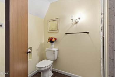 This 3-bedroom, 2-bath beauty sits on two very private lots on Bent Creek Golf Course in Tennessee - for sale on GolfHomes.com, golf home, golf lot