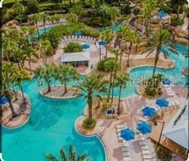 THIS STUNNING BEAUTIFUL 5 BEDROOMS 4 BATHROOMS CONDOMINIUM PLUS on Reunion Resort Golf Course in Florida - for sale on GolfHomes.com, golf home, golf lot