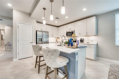 Discover this stunning first-floor coach home in the gated on Verandah Golf Course and Club in Florida - for sale on GolfHomes.com, golf home, golf lot