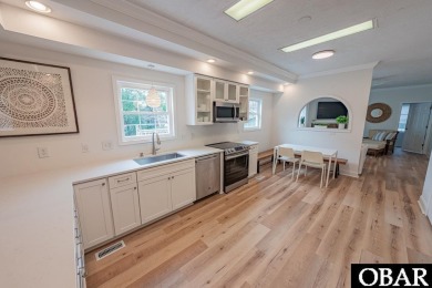 Welcome to your dream home, perfectly positioned in the heart of on Duck Woods Country Club in North Carolina - for sale on GolfHomes.com, golf home, golf lot