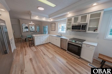 Welcome to your dream home, perfectly positioned in the heart of on Duck Woods Country Club in North Carolina - for sale on GolfHomes.com, golf home, golf lot
