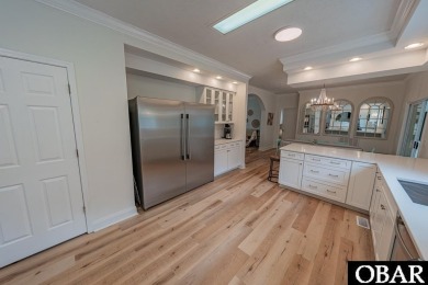 Welcome to your dream home, perfectly positioned in the heart of on Duck Woods Country Club in North Carolina - for sale on GolfHomes.com, golf home, golf lot