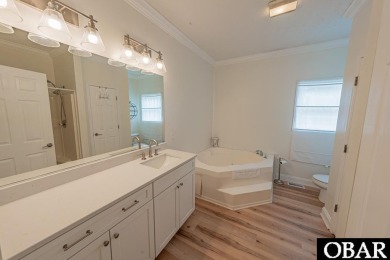 Welcome to your dream home, perfectly positioned in the heart of on Duck Woods Country Club in North Carolina - for sale on GolfHomes.com, golf home, golf lot