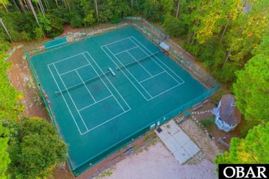 Welcome to your dream home, perfectly positioned in the heart of on Duck Woods Country Club in North Carolina - for sale on GolfHomes.com, golf home, golf lot