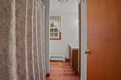 Nestled in the desirable Warwick Neck community, this inviting on Warwick Country Club in Rhode Island - for sale on GolfHomes.com, golf home, golf lot