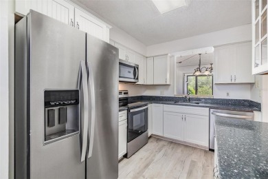 Welcome to this beautifully updated 2-bedroom, 2-bath condo in on Cove Cay Country Club in Florida - for sale on GolfHomes.com, golf home, golf lot