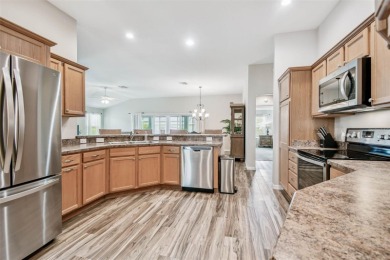 Beautifully maintained 3-bedroom, 2-bath Designer Home with a on Bella Glade Country Club in Florida - for sale on GolfHomes.com, golf home, golf lot