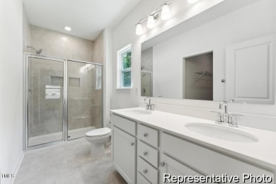 This semi-custom home in Lake Royale offers 3BR/2.5BA and 2,098 on River Golf and County Club at Lake Royale in North Carolina - for sale on GolfHomes.com, golf home, golf lot
