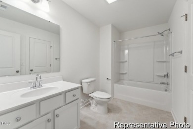 This semi-custom home in Lake Royale offers 3BR/2.5BA and 2,098 on River Golf and County Club at Lake Royale in North Carolina - for sale on GolfHomes.com, golf home, golf lot