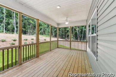 This semi-custom home in Lake Royale offers 3BR/2.5BA and 2,098 on River Golf and County Club at Lake Royale in North Carolina - for sale on GolfHomes.com, golf home, golf lot