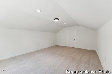 This semi-custom home in Lake Royale offers 3BR/2.5BA and 2,098 on River Golf and County Club at Lake Royale in North Carolina - for sale on GolfHomes.com, golf home, golf lot