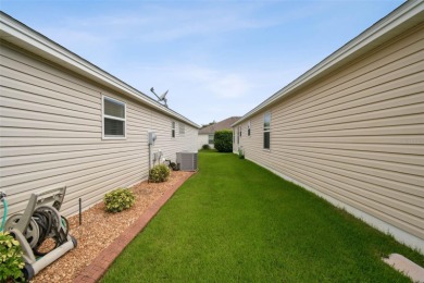 Beautifully maintained 3-bedroom, 2-bath Designer Home with a on Bella Glade Country Club in Florida - for sale on GolfHomes.com, golf home, golf lot