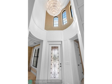 Experience resort style living in this lakefront Parkland Golf & on Parkland Golf Club in Florida - for sale on GolfHomes.com, golf home, golf lot