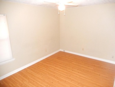 LOVELY Occupied SE Duplex w/ Carports, Fenced Yards, & Storage on Hilaman Park Golf Course in Florida - for sale on GolfHomes.com, golf home, golf lot