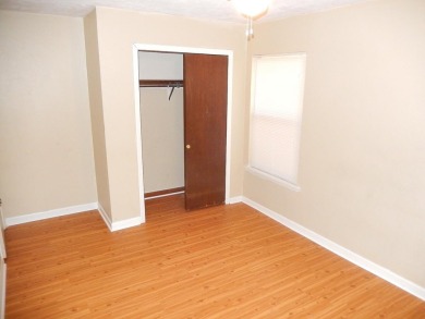 LOVELY Occupied SE Duplex w/ Carports, Fenced Yards, & Storage on Hilaman Park Golf Course in Florida - for sale on GolfHomes.com, golf home, golf lot