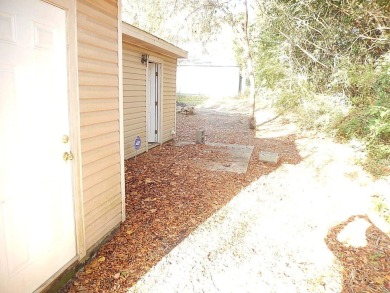 LOVELY Occupied SE Duplex w/ Carports, Fenced Yards, & Storage on Hilaman Park Golf Course in Florida - for sale on GolfHomes.com, golf home, golf lot