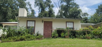 LOVELY Occupied SE Duplex w/ Carports, Fenced Yards, & Storage on Hilaman Park Golf Course in Florida - for sale on GolfHomes.com, golf home, golf lot