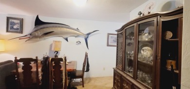 LOVELY Occupied SE Duplex w/ Carports, Fenced Yards, & Storage on Hilaman Park Golf Course in Florida - for sale on GolfHomes.com, golf home, golf lot