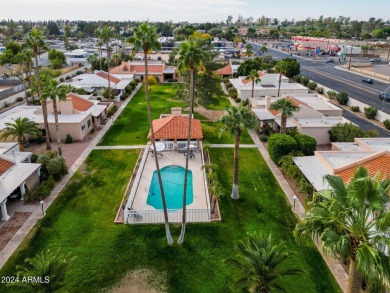 Located in a cozy 12-home community, this 3-bedroom, 2-bathroom on Mesa Country Club in Arizona - for sale on GolfHomes.com, golf home, golf lot