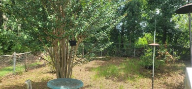 LOVELY Occupied SE Duplex w/ Carports, Fenced Yards, & Storage on Hilaman Park Golf Course in Florida - for sale on GolfHomes.com, golf home, golf lot