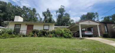 LOVELY Occupied SE Duplex w/ Carports, Fenced Yards, & Storage on Hilaman Park Golf Course in Florida - for sale on GolfHomes.com, golf home, golf lot
