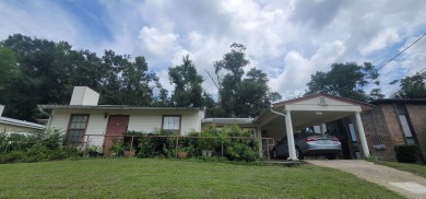 LOVELY Occupied SE Duplex w/ Carports, Fenced Yards, & Storage on Hilaman Park Golf Course in Florida - for sale on GolfHomes.com, golf home, golf lot