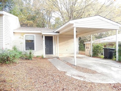 LOVELY Occupied SE Duplex w/ Carports, Fenced Yards, & Storage on Hilaman Park Golf Course in Florida - for sale on GolfHomes.com, golf home, golf lot