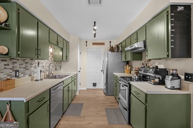 Welcome home to this lovely 4 bedroom, 2 bath ranch with 1,862 on Cherokee Rose Country Club in Georgia - for sale on GolfHomes.com, golf home, golf lot