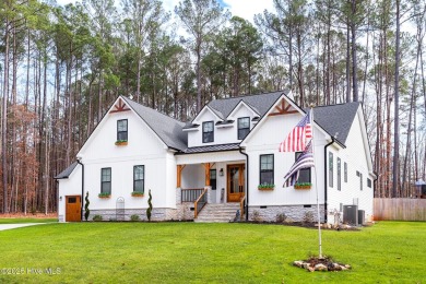 Welcome to this stunning & charming farmhouse-style home on River Golf and County Club at Lake Royale in North Carolina - for sale on GolfHomes.com, golf home, golf lot