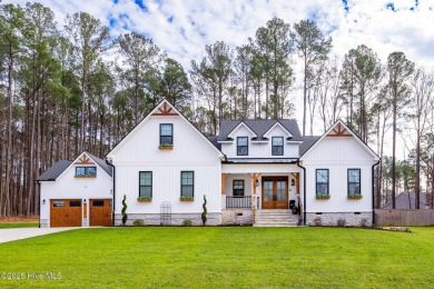 Welcome to this stunning & charming farmhouse-style home on River Golf and County Club at Lake Royale in North Carolina - for sale on GolfHomes.com, golf home, golf lot