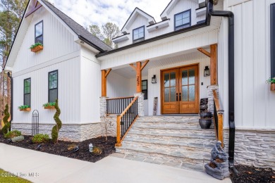 Welcome to this stunning & charming farmhouse-style home on River Golf and County Club at Lake Royale in North Carolina - for sale on GolfHomes.com, golf home, golf lot