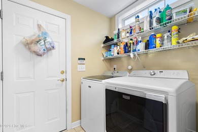 Welcome to 7401 Balmore Drive SW- your next primary residence or on Sandpiper Bay Golf and Country Club in North Carolina - for sale on GolfHomes.com, golf home, golf lot