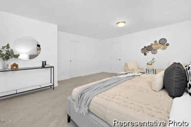 This semi-custom home in Lake Royale offers 3BR/2.5BA and over 2 on River Golf and County Club at Lake Royale in North Carolina - for sale on GolfHomes.com, golf home, golf lot