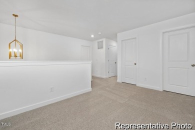 This semi-custom home in Lake Royale offers 3BR/2.5BA and over 2 on River Golf and County Club at Lake Royale in North Carolina - for sale on GolfHomes.com, golf home, golf lot