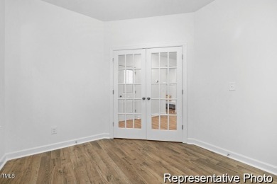 This semi-custom home in Lake Royale offers 3BR/2.5BA and over 2 on River Golf and County Club at Lake Royale in North Carolina - for sale on GolfHomes.com, golf home, golf lot